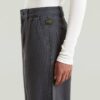 Geplooide taps toelopende chino