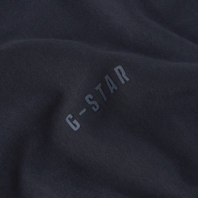 Losse T-shirt met geborduurde tekst op de achterkant