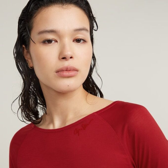 Slim-fit top met lage rug en 3/4 mouwen Slim-fit top met lage rug en 3/4 mouwen