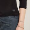 Slim-fit top met lage rug en 3/4 mouwen Slim-fit top met lage rug en 3/4 mouwen