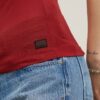 Slim-fit top met lage rug en 3/4 mouwen Slim-fit top met lage rug en 3/4 mouwen