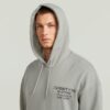 Trui met grafische print en capuchon Trui met grafische print en capuchon