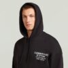 Trui met grafische print en capuchon Trui met grafische print en capuchon